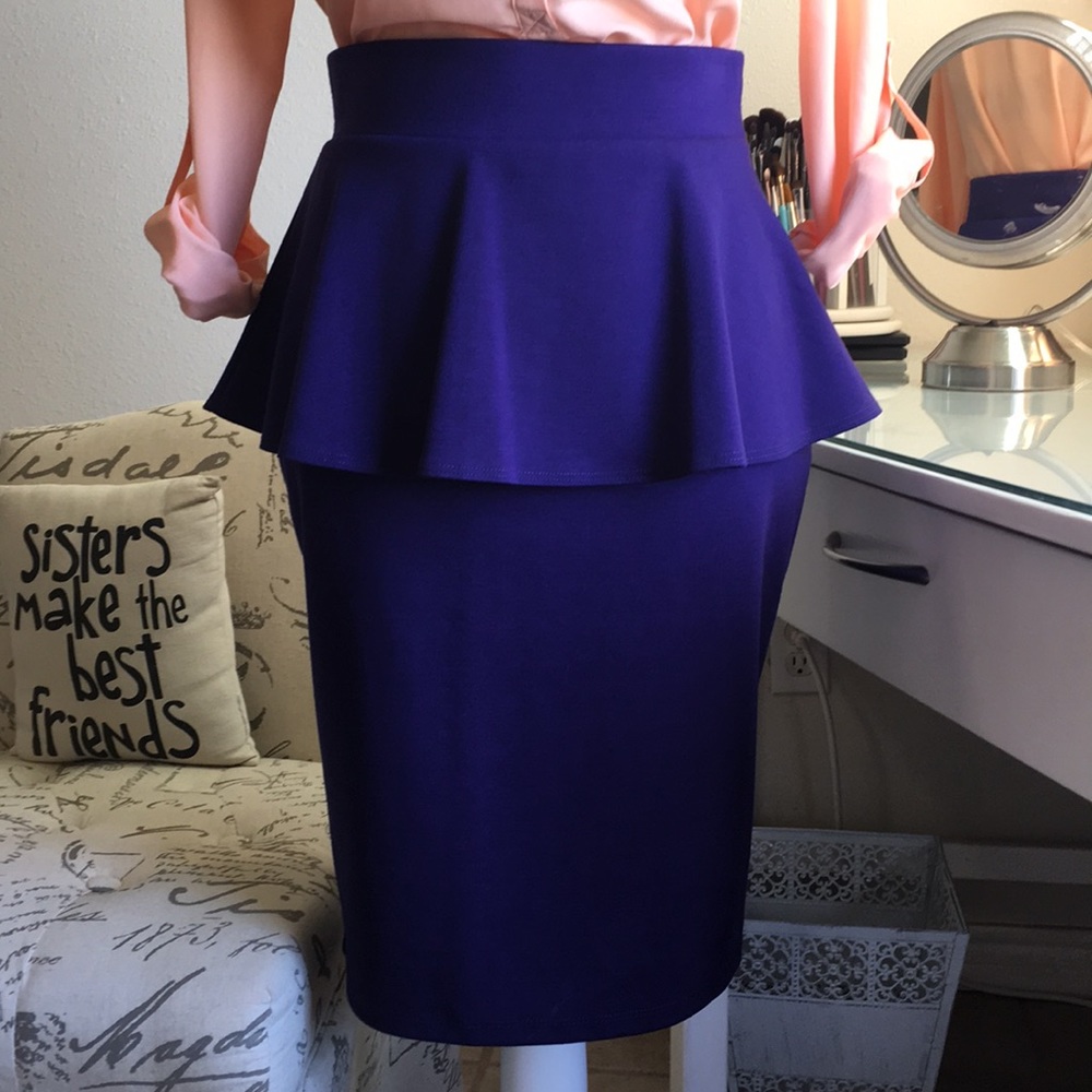 NWOT Stunning purple peplum skirt .